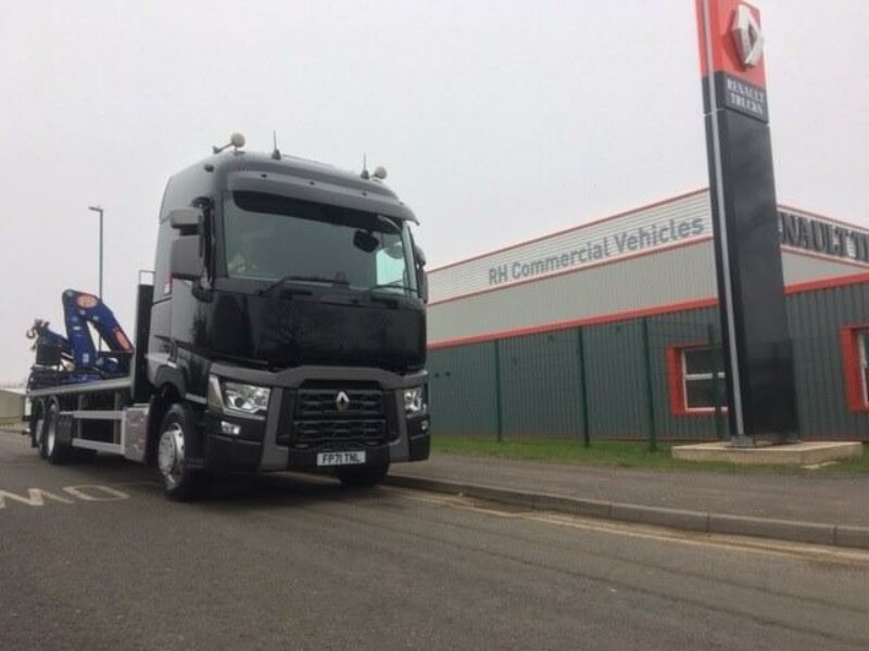 One of GMI's six T range flatbed trucks parked outside RHCV