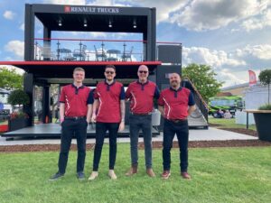 The RHCV team stood outside a Renault exhibit on a summers day