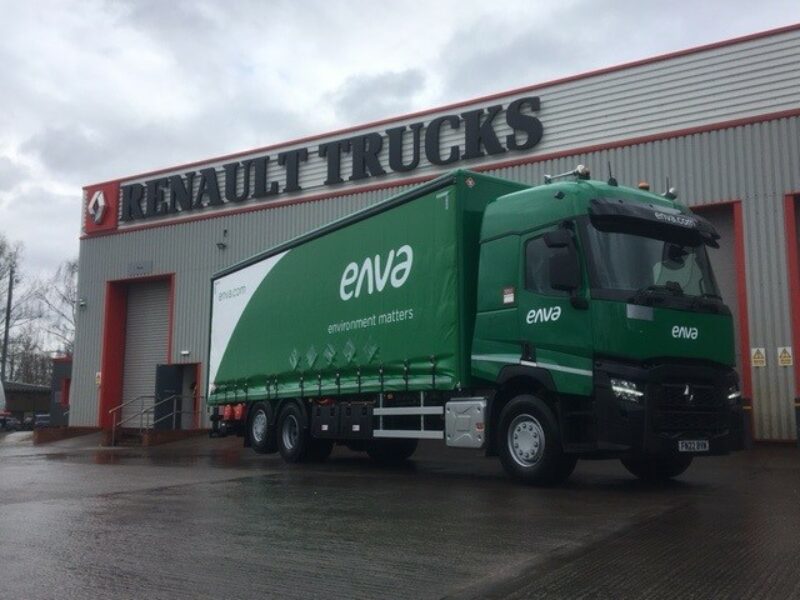 A dark green Enva truck parked outside RHCV