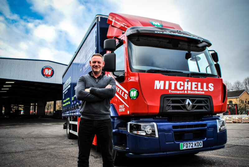 Mitchells of Mansfield, the overnight pallet distributor based in Nottinghamshire, has received the UK’s first 18-tonne E Tech electric curtain-sided truck from RH Commercial Vehicles, the East Midlands’ largest independent Renault Trucks dealer. Mitchells of Mansfield is a family-run business that started in 1968. In 1995, it became a founding member of Palletways and has also worked with The Pallet Network, Palletline, and The Hazchem Network. Over the past year, the company has been taking steps toward reducing and offsetting its carbon emissions. New goals have been set to achieve this by 2023, they aim to offset 25% of their carbon, 50% by 2024 and 100% of their carbon by 2026. The addition of the Renault Trucks E-Tech D Wide will significantly help these aims. Richard Montgomery, Managing Director, commented, “Progression and positive change is a cornerstone of the business. We are doing just that by investing in the latest equipment like the Renault Trucks E-Tech vehicle. “Our decisions on technology and equipment are based on the reduction of our environmental impact. We want to set the benchmark for the palletised market, by dipping our toes in electromobility, we can prove we are a sustainable business built on trust, sincerity, and responsibility.” The Renault Trucks E-Tech D Wide is the ideal vehicle for urban deliveries and its zero tailpipe emissions qualify it to operate in cities that are reducing their CO2 emissions and improving air quality. Their low noise output also makes them perfect for these areas. It is fitted with four battery packs which provide 66kW of energy each and the truck is equipped with an onboard AC charger and is compatible with DC fast charging. This allows fast charging of the vehicle to maximise its daily operational range. A lot of Mitchells of Mansfield’s operations are within Nottingham City Centre. The city has launched high-level objectives to have a resilient and carbon-neutral city by 2028. According to A study, 30% of CO2 emissions come from transport. Initiatives such as clean air zones are being researched which can affect freight deliveries. Richard Montgomery commented, “It is becoming increasingly clear that zero emissions and sustainable transport solutions are an inevitable future in this industry. “It is important to get ahead of the curve and get used to this method of transportation before it is too late. “It is a huge investment to decarbonise a fleet but by introducing this truck now, we can determine our next steps in improving our carbon footprint.” Simon Bailey, Sales Executive for RHCV, commented. “The truck will be incredibly reliable to Mitchells of Mansfield; it can keep up with the business demands whilst having the capacity to complete a full day’s work on a single charge and emitting zero tailpipe emissions. This also means that it can operate in low-emission zones such as London. “With it being a curtain-sided vehicle fitted with a tail lift too, means the business can continue to operate quickly and efficiently with speedy load and unload benefits and simplified partial deliveries as they did before on the equivalent diesel-fuelled vehicles.” To ensure safety as well as sustainability, the vehicle has been fitted with the full halo system from SM UK. This includes front, rear and side cameras which provide the driver with a bird’s eye view of what is happening around them. Steve MacDonald MD of SM UK Ltd commented, “Safety on our roads is of utmost importance both in terms of the driver and the vulnerable road user, Sidescan will aid the driver with blind spots whilst Halo will activate and illuminate when in low light situation or turning left” Combined with cameras, sensors and audible warning systems, the chances of a collision occurring are drastically reduced, making the roads safer for drivers and vulnerable road users. Steve also stated, “With most local authorities now aiming to create cleaner air zones, what Mitchells of Mansfield has done is start the process of reducing their own carbon footprint with the purchase of The Renault Trucks E-Tech D” Richard Montgomery commented, “Ensuring the safety of the driver and those around them is paramount to the business. The installation of the halo system will ensure that the driver can operate safely and keep other vulnerable road users, especially in built-up areas out of danger.” The vehicle will be used for localised deliveries and collections. Richard Montgomery commented, “It has been fantastic to work with RH Commercial Vehicles on such a drastic change. We have had a great working relationship for many years, so we are confident that we are in safe hands as the electric truck goes into operation. “Having the first truck of its kind in the UK is an incredibly exciting development for the business and I look forward to seeing how it performs in the business.” Paul Pearson, Commercial Director of RH Commercial Vehicles commented, “It has been great to work with a company that shares our commitment to innovation and consideration for the world around us. I believe this vehicle will be an asset to the business, and we will be working closely with Mitchells of Mansfield as they discover the potential of electric mobility.” Renault Trucks maintain its goal for all its vehicle sales to be completely fossil free. To support these ambitions, their 360° support for customers who branch into electromobility is readily available allowing firsts such as this. ENDS Media Contacts: RH Commercial Vehicles: Grace Pells, communications executive. E: grace.pells@rhcv.co.uk. T:0115 976 547. M: 07468729204. SMUK: Note to editors: Renault Trucks E-Tech D Wide Technical specifications: • GVWR of 18 tonnes • Wheelbase: 6.100mm • Two electric alternating current synchronous motors • Max Torque of electric engines: 850Nm • Two-speed gearbox RH Commercial Vehicles: RHCV is the one-stop shop for commercial vehicle sales, rentals, parts, servicing, and repair of vehicles from 3.5 tonnes to 44 tonnes. They are an official Vertellus partner and licensee for sustainable contract hire. They are test station approved, run DVSA tachograph centres and run 24-hour breakdown recovery with fully equipped vans and skilled operators. Each workshop has an extensive parts department. The Nottingham depot has a state-of-the-art paint shop and is an official Renault Trucks service and repair depot. Mitchells of Mansfield: Rooted in family values, Mitchells of Mansfield has been an overnight pallet freight distributor based in Nottinghamshire since 1968. They specialise in overnight pallet delivery, collection, and courier services to and from most UK destinations, Ireland, The Channel Islands, and mainland Europe. SMUK: Leeds-based firm SM UK Ltd are the UK’s leading auto electrical installation specialist… providing the latest in AI cameras, sensors and recording systems along with fitting the trademarked low level lighting HALO system as well as truck door windows. SM UK Ltd have three main sites including the new Leeds workshop, Tamworth and the recently acquired workshop in Dartford totalling 60,000 sq. ft. Employing 70 mobile engineers nationwide providing the most comprehensive UK wide service to fleet managers and global manufacturers such as Renault. As a prominent advocate of FORS, CLOCS and DVS, SM UK Ltd have designed and fitted vehicle safety and vulnerable road user awareness systems, all fully type approved to fleets for over 20 years. The HALO® Kit: HALO® is one of SM UK’s own innovative products, designed and manufactured in-house. The pioneering system provides a visual warning to vulnerable road users that your vehicle is turning. Sidescan®: Sidescan® - Is a four-sensor system fitted to the side of a vehicle to detect objects in the nearside blind spot, where cyclists or pedestrians can otherwise go undetected. An advancement to the standard Sidescan® system, Sidescan® Flex allows the operator to choose from four detection configurations, each with different detection distances and audible visual alerts. Sidescan® has a maximum detection range of 2.5 metres.
